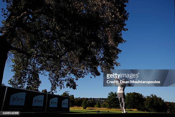 Richard Sterne of South Africa hits his tee shot on the 1st hole during the Day One of the Joburg Open at Royal Johannesburg and Kensington Golf Club...