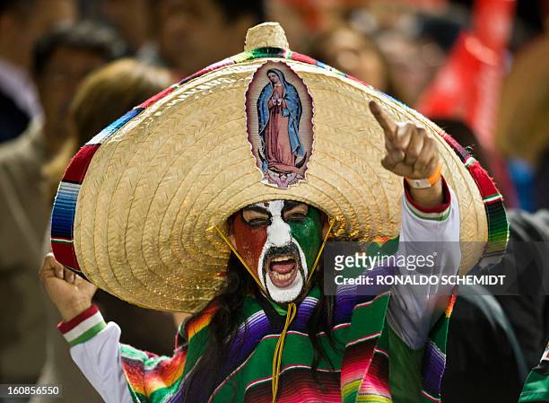 Fan of Yaquis de Obregon of Mexico cheers in a match against Criollos de Caguas of Puerto Rico during the 2013 Caribbean baseball series on February...