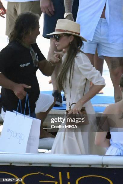 Victoria Beckham and David Beckham are seen arriving at restaurant Lo Scoglio on August 18, 2023 in Nerano, Italy.