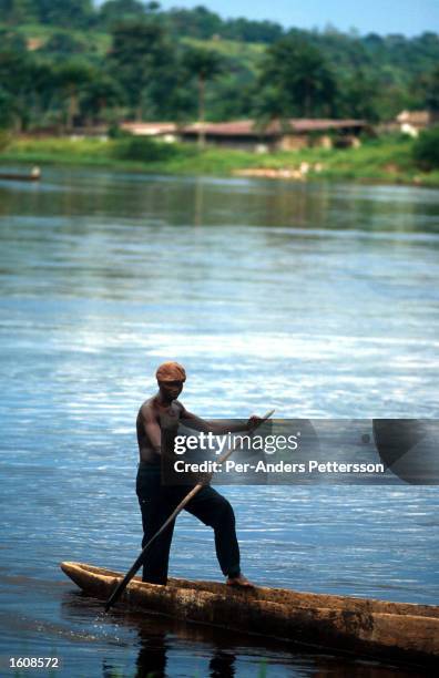 Man travels by canoe on the Congo river on April 13 in Kikwit, The Democratic Republic of Congo. Kikvit was the center of an Ebola outbreak in 1995...