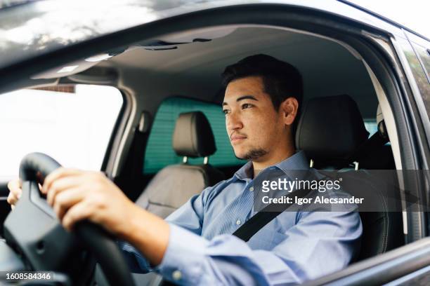 portrait of a driver man paying attention - travel real people stockfoto's en -beelden
