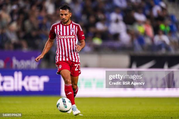 Joao Carvalho of Olympiakos Piraeus runs with the ball during the UEFA Europe League Qualification Third Round Second Leg match between KRC Genk and...