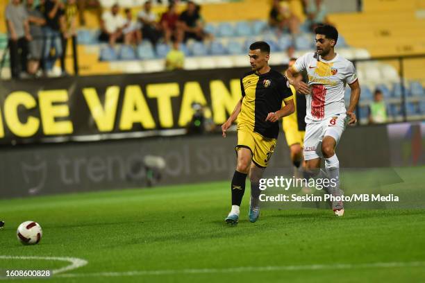 Florian Loshaj of Istanbulspor and Ali Karimi of Kayserispor battle for the ball during the Super Lig match between Istanbulspor and Kayserispor at...