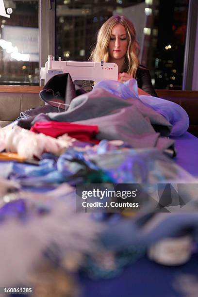 Designer Ashley Cooper works on her design during the Aquafina "Pure Challenge" at the Aquafina "Pure Challenge" After Party at The Empire Hotel...