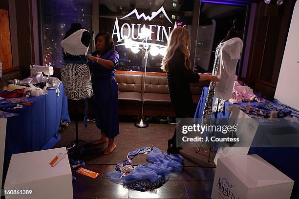 Designers Carmen Green and Ashley Cooper work on their designs during the Aquafina "Pure Challenge" at the Aquafina "Pure Challenge" After Party at...