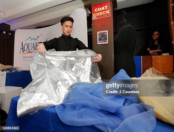 Designer Tony Vo works on his design during the Aquafina "Pure Challenge" at the Aquafina "Pure Challenge" After Party at The Empire Hotel Rooftop on...