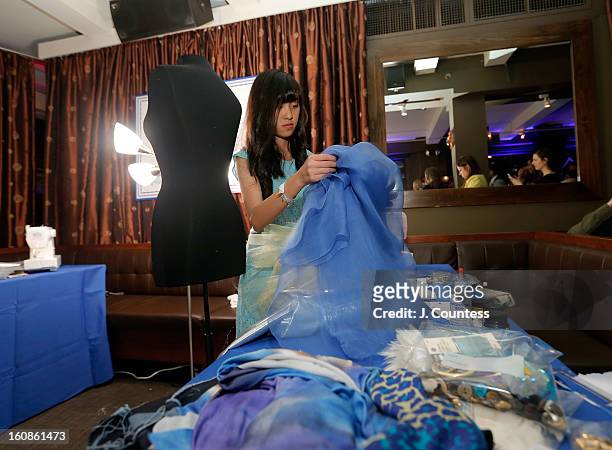 Designer Alaina Thai works on her design during the Aquafina "Pure Challenge" at the Aquafina "Pure Challenge" After Party at The Empire Hotel...