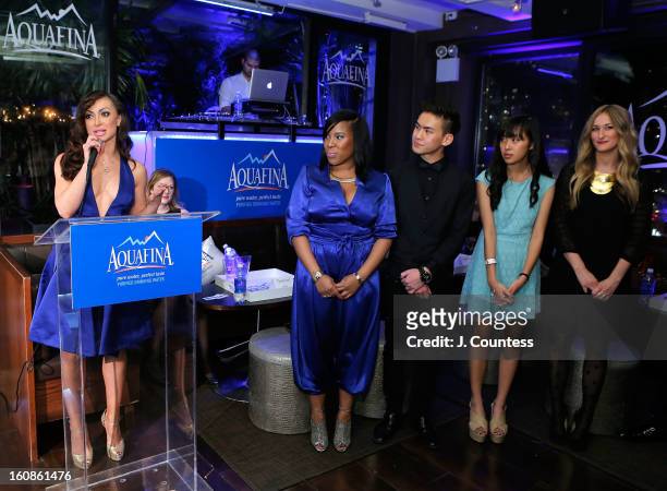 Dancer and host Karina Smirnoff introduces the competitors during the Aquafina "Pure Challenge" at the Aquafina "Pure Challenge" After Party at The...