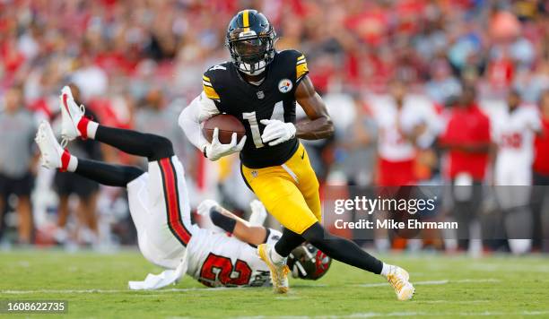 George Pickens of the Pittsburgh Steelers rushes after a catch for a touchdown during a preseason game against the Tampa Bay Buccaneers at Raymond...