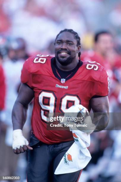 Defensive lineman Warren Sapp of the Tampa Bay Buccaneers jogs off the field after warm ups prior to a game on December 9, 2001 against the Detroit...