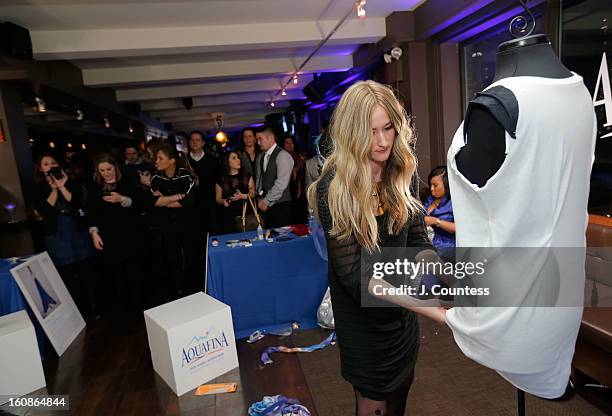 Designer Ashley Cooper works on her design during the Aquafina "Pure Challenge" at the Aquafina "Pure Challenge" After Party at The Empire Hotel...