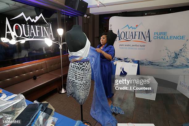 Designer Carmen Green works on her design during the Aquafina "Pure Challenge" at the Aquafina "Pure Challenge" After Party at The Empire Hotel...