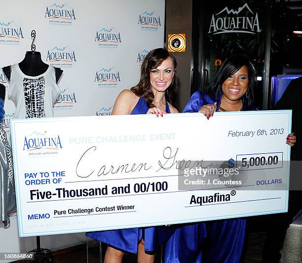 Dancer and host Karina Smirnoff and designer Carmen Green of Baltimore, MD pose for a photo after Carmen is declared the winner of the Aquafina "Pure...