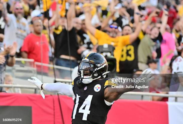George Pickens of the Pittsburgh Steelers reacts after scoring a touchdown in the first quarter against the Tampa Bay Buccaneers during a preseason...