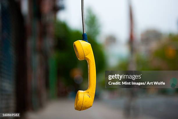streets of new york city. usa. an abandoned telephone receiver. - phone receiver stock pictures, royalty-free photos & images