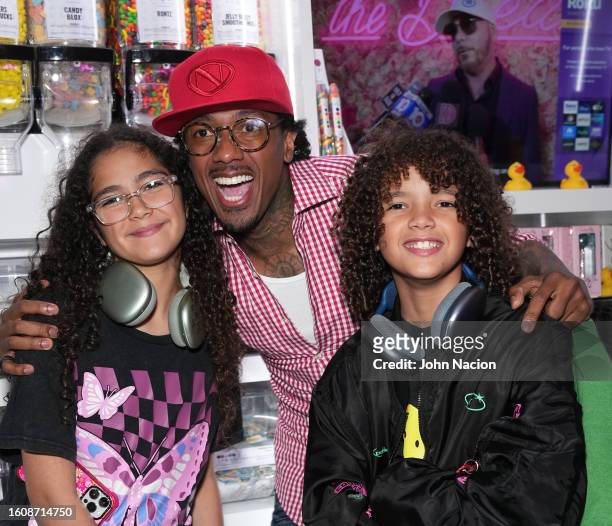 Moroccan Cannon, Nick Cannon and Monroe Cannon attend the Natti Natasha & Nick Cannon host Sugar Factory in Times Square on August 11, 2023 in New...