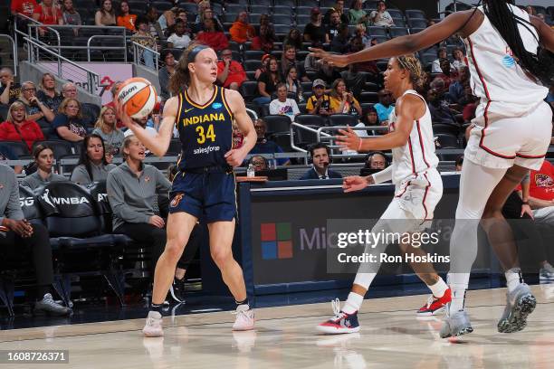 Grace Berger of the Indiana Fever handles the ball during the game against the Washington Mystics on August 18, 2023 at Gainbridge Fieldhouse in...