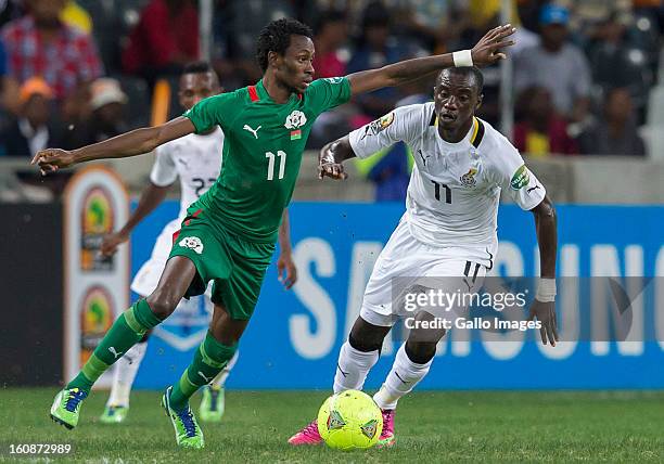 Jonathan Pitroipa from Burkina Faso and Rabiu Alhassan Mohammed from Ghana during the 2013 Orange African Cup of Nations 2nd Semi Final match between...