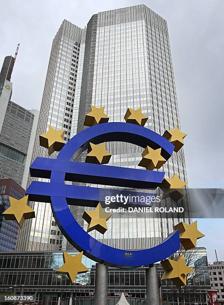 German artist Ottmar Hoerl 's sculpture depicting the Euro logo is seen in front of the European Central Bank where a press conference is held...