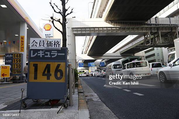 Board shows 146 Japanese yen per liter, at a gas station on February 7, 2013 in Tokyo, Japan. A recent servey shows Tokyo as the most expensive city...