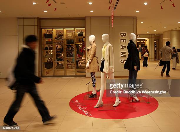 Commutors walk at Osaka Station past shopping area on February 6, 2013 in Osaka, Japan. A recent servey shows Tokyo as the most expensive city in the...