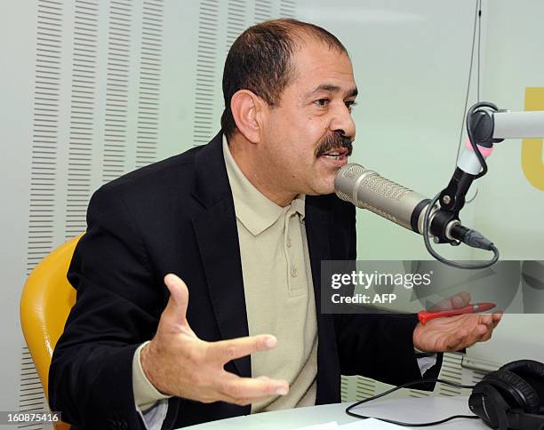 Picture taken on November 20, 2012 shows Tunisian lawyer and opposition leader Chokri Belaid speaking during a radio interview in Tunis. Chokri...