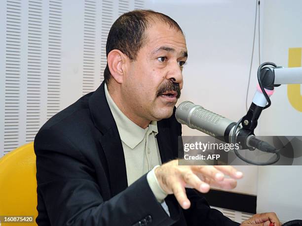 File picture taken on November 20, 2012 shows Tunisian lawyer and opposition leader Chokri Belaid speaking during a radio interview in Tunis. Chokri...