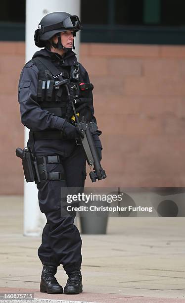 Armed police stand guard as the trial of Dale Cregan and nine other co-defendants face charges of murder and attempted murder at Preston Crown Court...