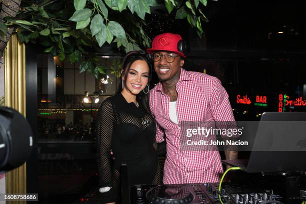 Natti Natasha and Nick Cannon attend the Natti Natasha & Nick Cannon host Sugar Factory in Times Square on August 11, 2023 in New York City.