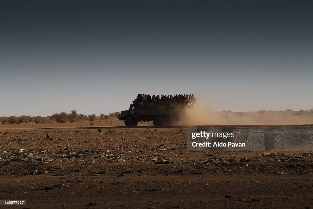 Truck load of migrants crossing the desert