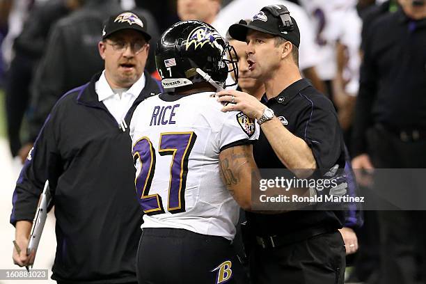 Head coach John Harbaugh and Ray Rice of the Baltimore Ravens talk on the field against the San Francisco 49ers during Super Bowl XLVII at the...