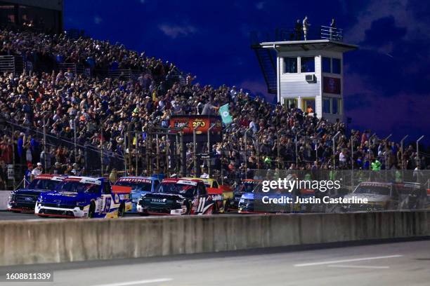 Christian Eckes, driver of the NAPA Auto Care Chevrolet, leads the field to the green flag to start the NASCAR Craftsman Truck Series TSport 200 at...