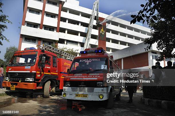 Mock earthquake rescue drill, at Mini Secretariat, on February 7, 2013 in Gurgaon, India. Mock drill organized by Gurgaon Disaster Management...