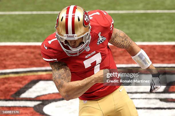 Colin Kaepernick of the San Francisco 49ers reacts after he scored a 15-yard rushing touchdown in the fourth quarter against the Baltimore Ravens...