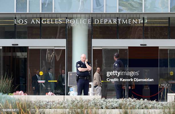 Los Angeles Police Department officers are deployed around the police headquarters on February 7, 2013 in Los Angeles, California. A former Los...