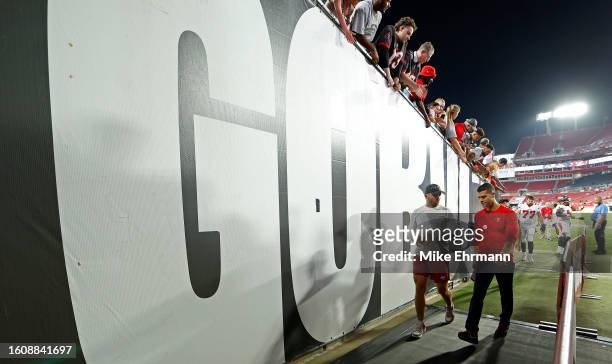 Baker Mayfield of the Tampa Bay Buccaneers walks off the field after a preseason game against the Pittsburgh Steelers at Raymond James Stadium on...
