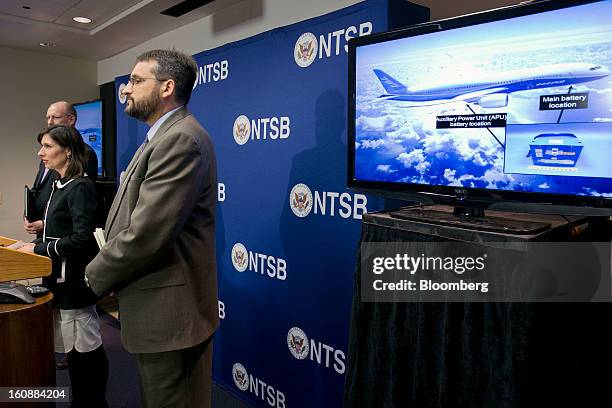 Deborah Hersman, chairman of the National Transportation Safety Board , left, speaks during a news conference showing a Boeing Co. 787 Dreamliner on...