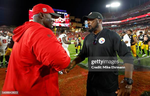 Tampa Bay Buccaneers head coach Todd Bowles and Pittsburgh Steelers head coach Mike Tomlin shake hands during a preseason game against the Pittsburgh...