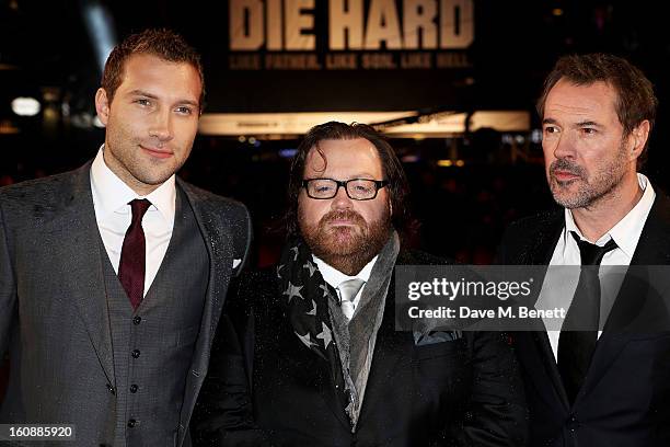 Actor Jai Courtney, director John Moore and actor Sebastian Koch attend the UK Premiere of 'A Good Day To Die Hard' at Empire Leicester Square on...