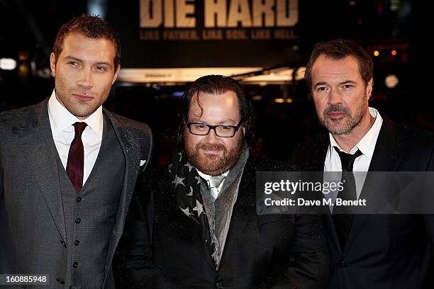 Actor Jai Courtney, director John Moore and actor Sebastian Koch attend the UK Premiere of 'A Good Day To Die Hard' at Empire Leicester Square on...