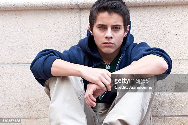serious hispanic teenager - boy brown hair stock pictures, royalty-free photos & images