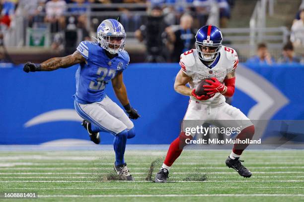 Cole Beasley of the New York Giants catches a pass against Brian Branch of the Detroit Lions in the first quarter of a preseason game at Ford Field...