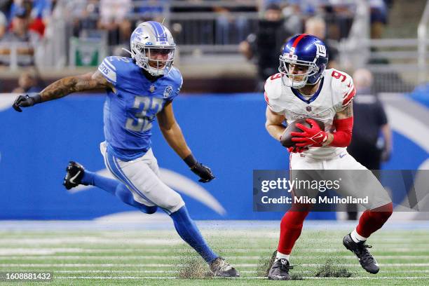 Cole Beasley of the New York Giants catches a pass against Brian Branch of the Detroit Lions in the first quarter of a preseason game at Ford Field...