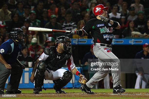 Karim Garcia of Mexico watches the flight of his home run during a match between Mexico and Puerto Rico for the Caribbean Series 2013 on February 6,...