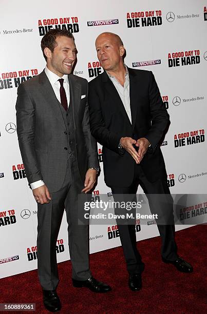 Actors Jai Courtney and Bruce Willis attend the UK Premiere of 'A Good Day To Die Hard' at Empire Leicester Square on February 7, 2013 in London,...