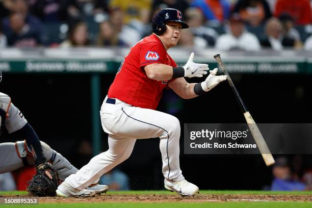 Kole Calhoun of the Cleveland Guardians drops his bat after hitting a double off Joey Wentz of the Detroit Tigers during the fourth inning of game...