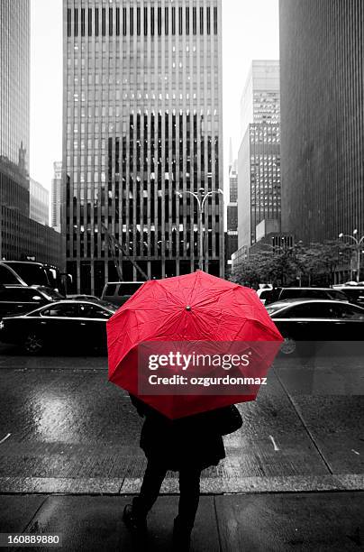 woman with a red umbrella in new york city - black and white colour stock pictures, royalty-free photos & images