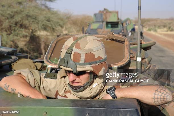 Convoy of French army vehicules heads toward Gao on February 7, 2013 on the road from Gossi. Four Malian civilians were killed by a landmine in...