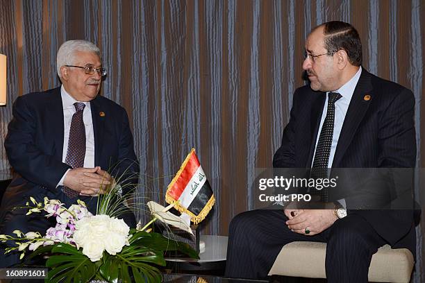 In this handout image supplied by the PPO , Palestinian President Mahmoud Abbas attends a meeting with Iraqi Prime Minister Nuri al-Maliki during an...