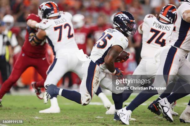 Unning back Samaje Perine of the Denver Broncos rushes the football against the Arizona Cardinals during the first half of the NFL game at State Farm...